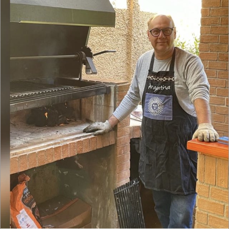 Julio at the parrilla in his Argentina apron